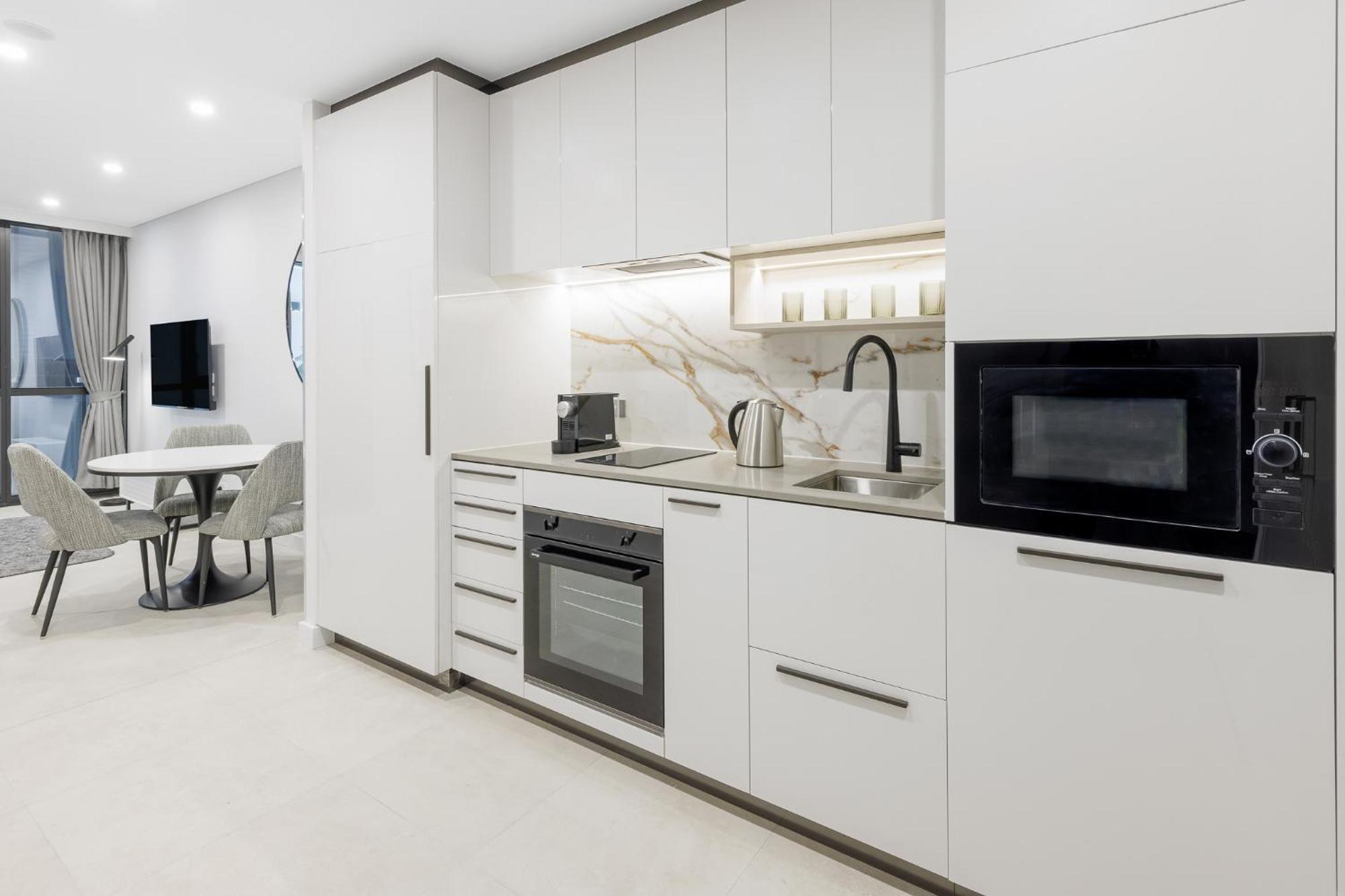 Meriton Suites Camberra Exterior foto A typical kitchen in a serviced apartment