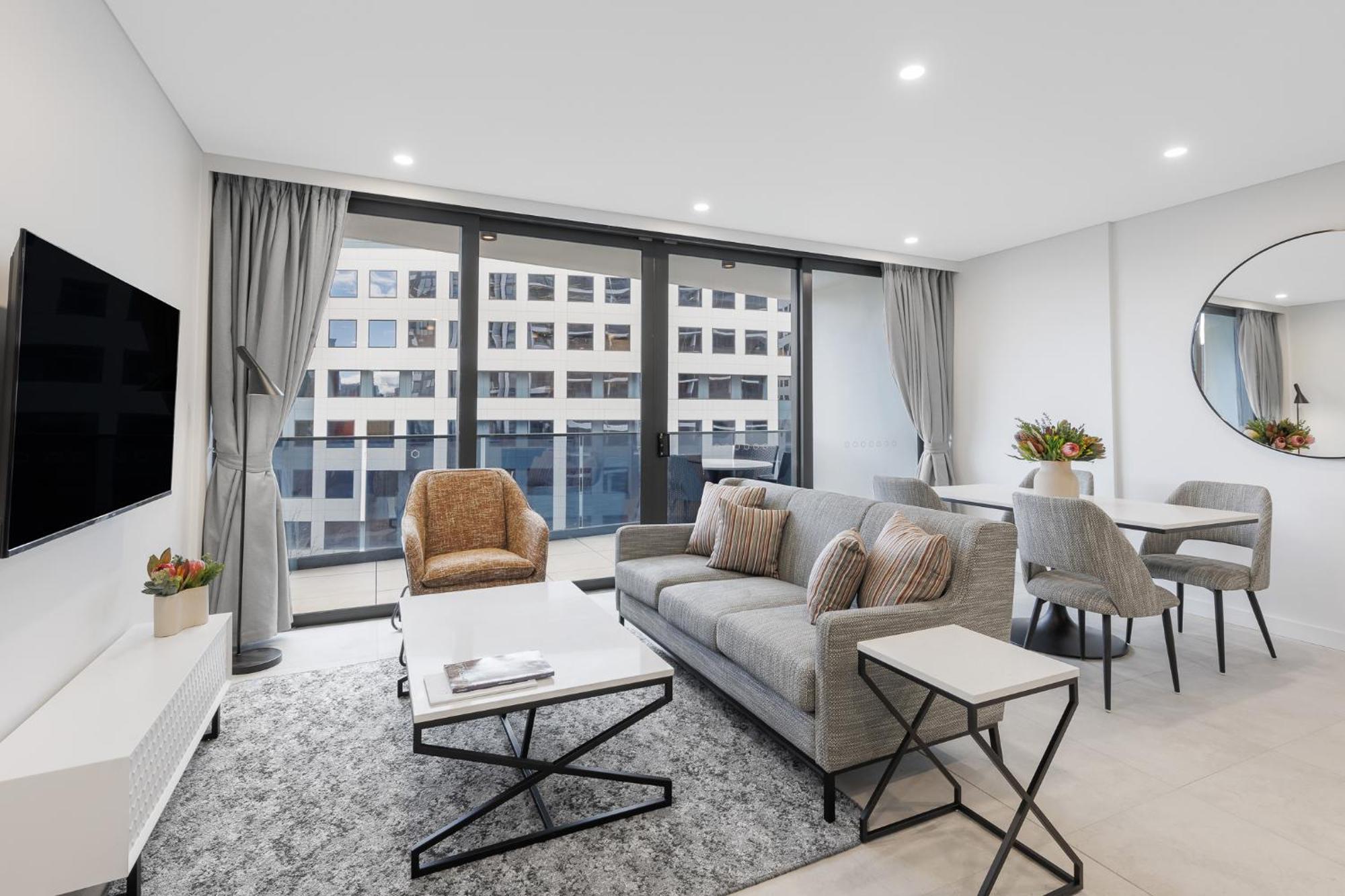 Meriton Suites Camberra Exterior foto Living room