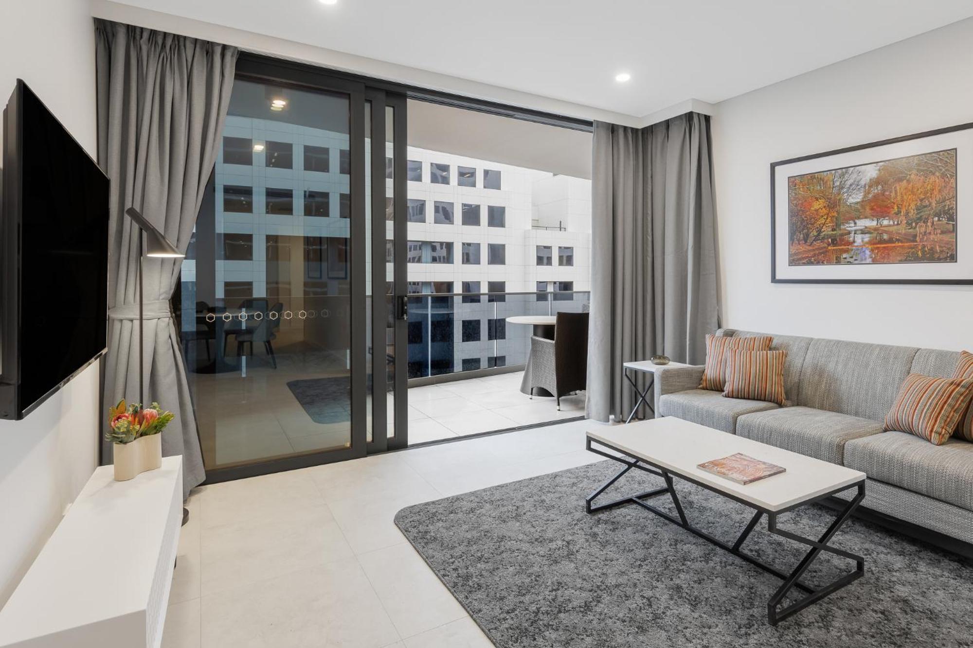 Meriton Suites Camberra Exterior foto Living room