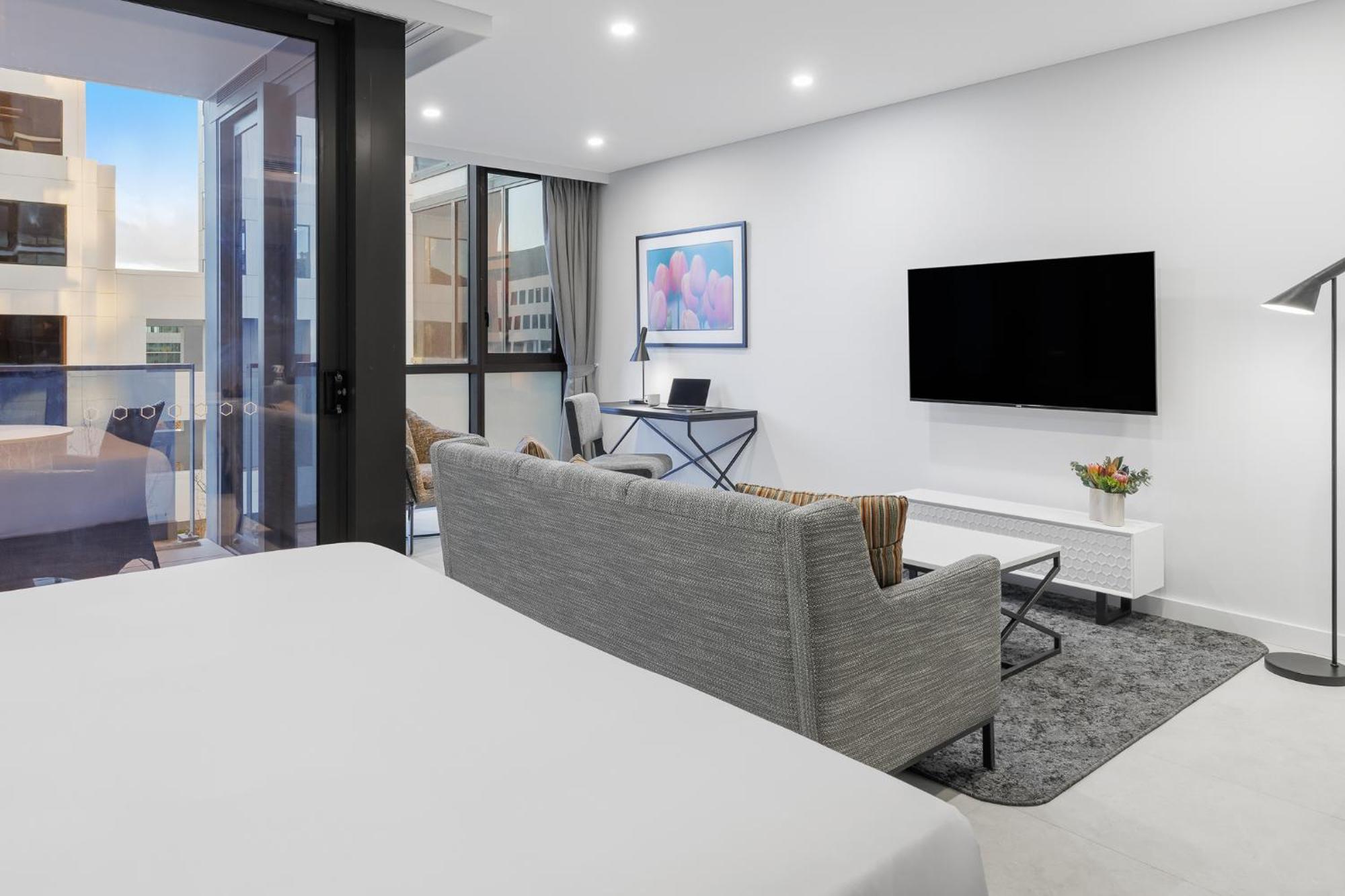 Meriton Suites Camberra Exterior foto The interior of a typical apartment